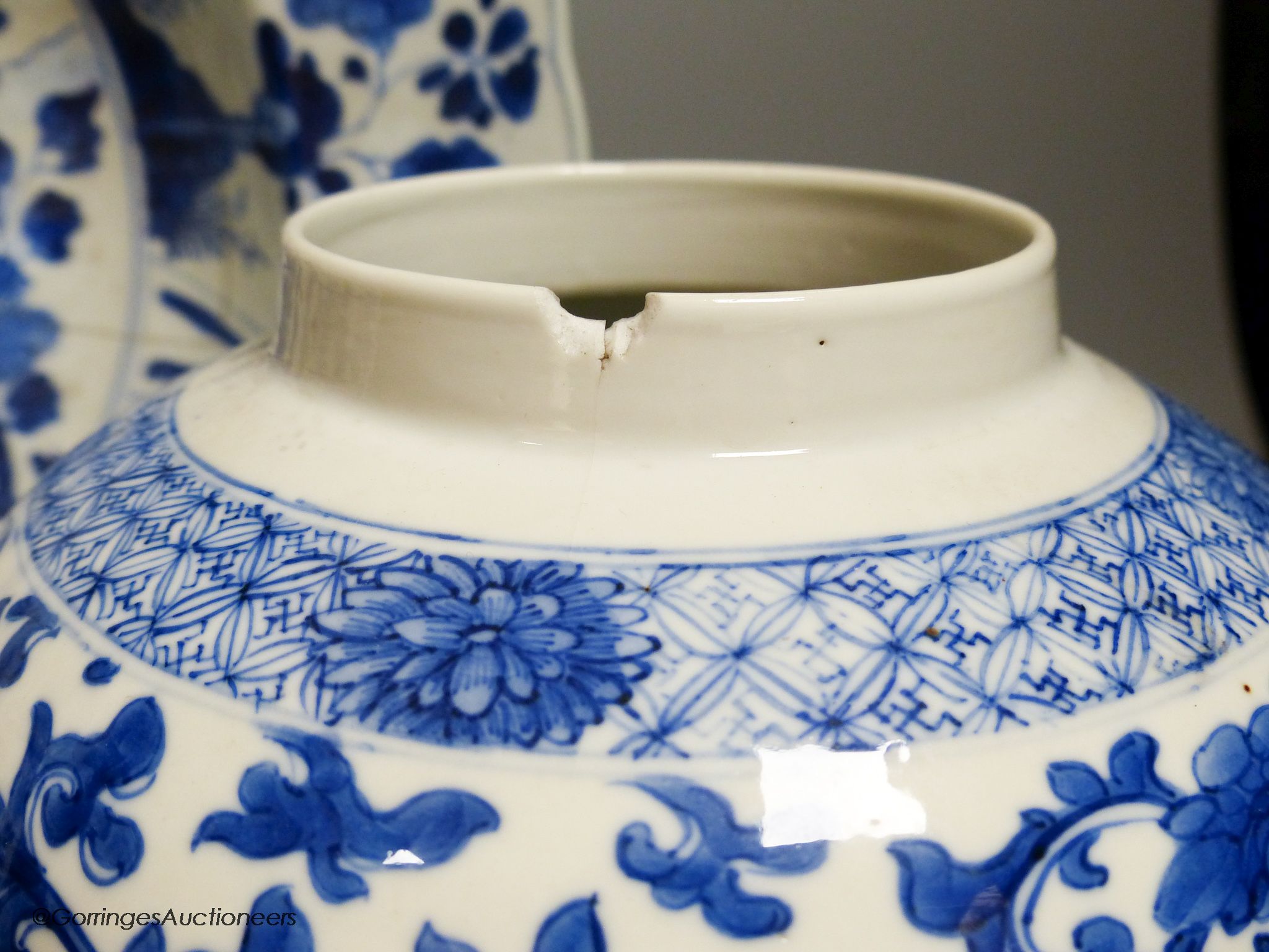 A Chinese blue and white dish, Kangxi mark and of the period, diameter 34cm, and a 19th century Chinese blue and white jar